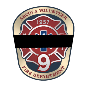Badge for Arcola Volunteer Fire Department with the number 9 in the center, partly covered by a black mourning band.